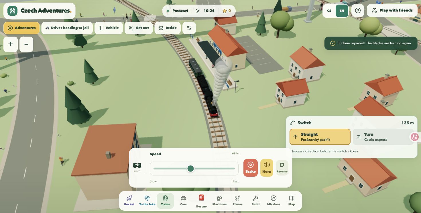 A steam train passes through a miniature Czech town with speed and railway-switch controls.