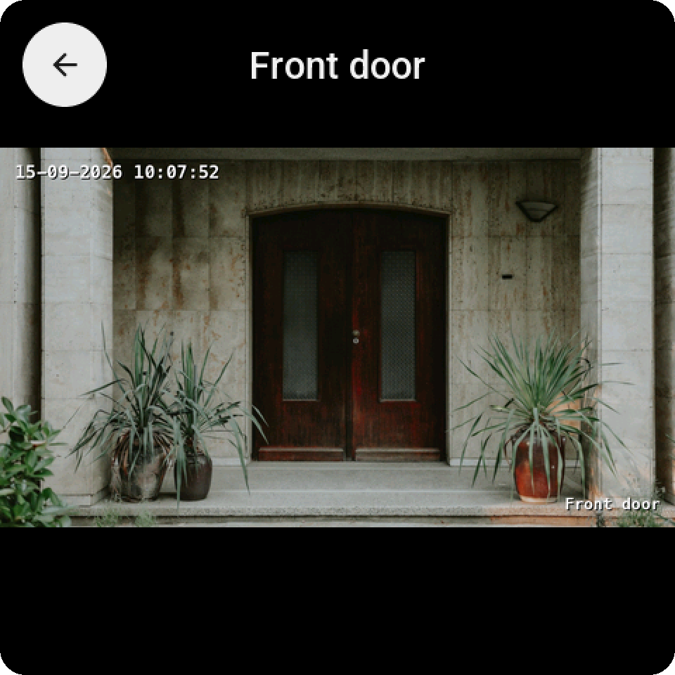 A camera tile tapped: the front door camera full screen, with the round back key and the camera's name at the top
