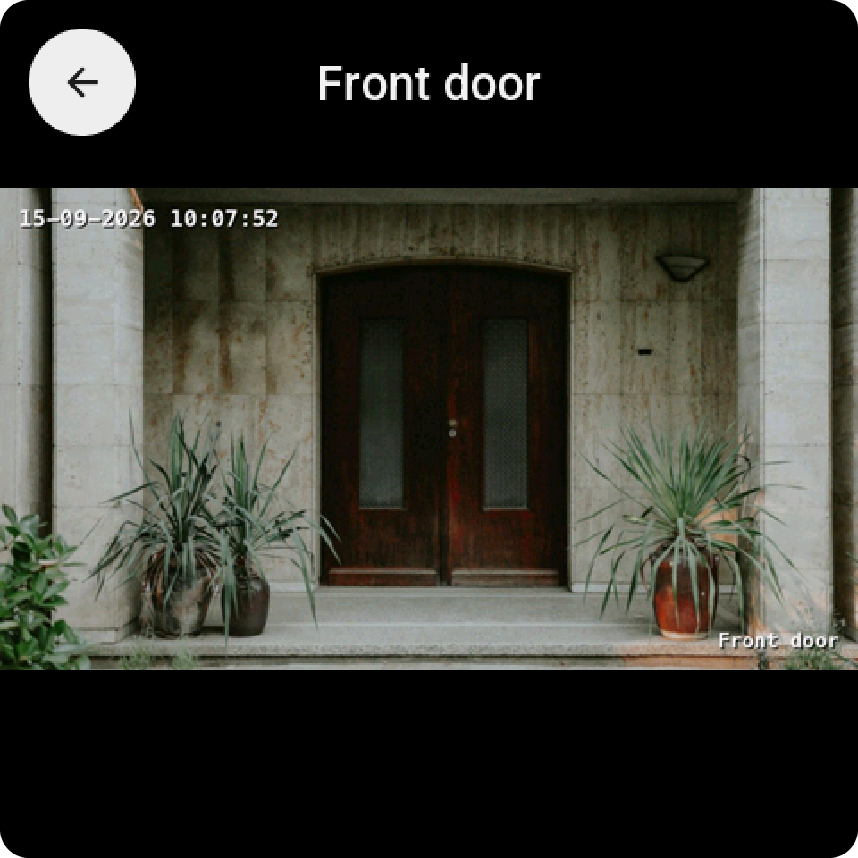 A camera tile tapped: the front door camera full screen, with the round back key and the camera's name at the top