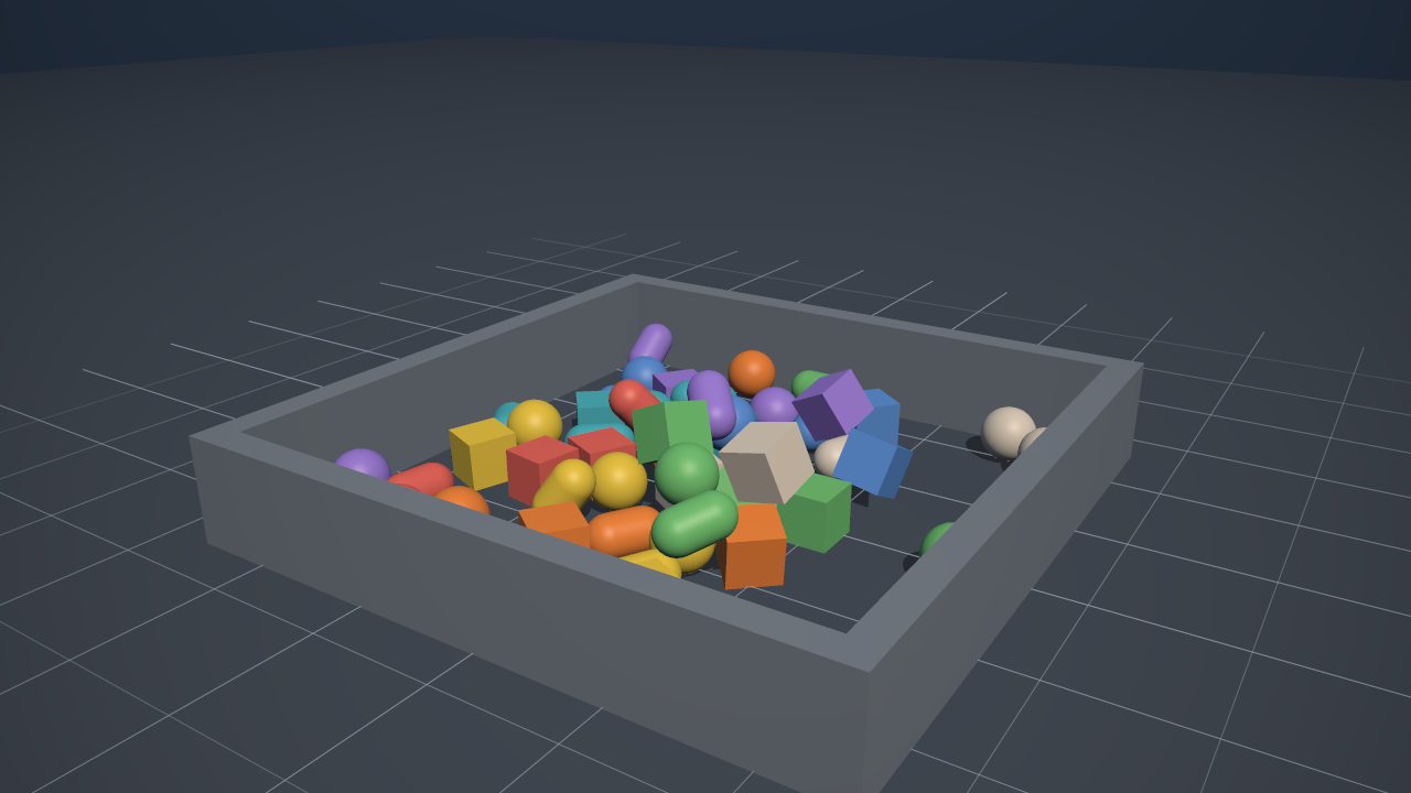 Spheres, capsules and boxes poured into a pen