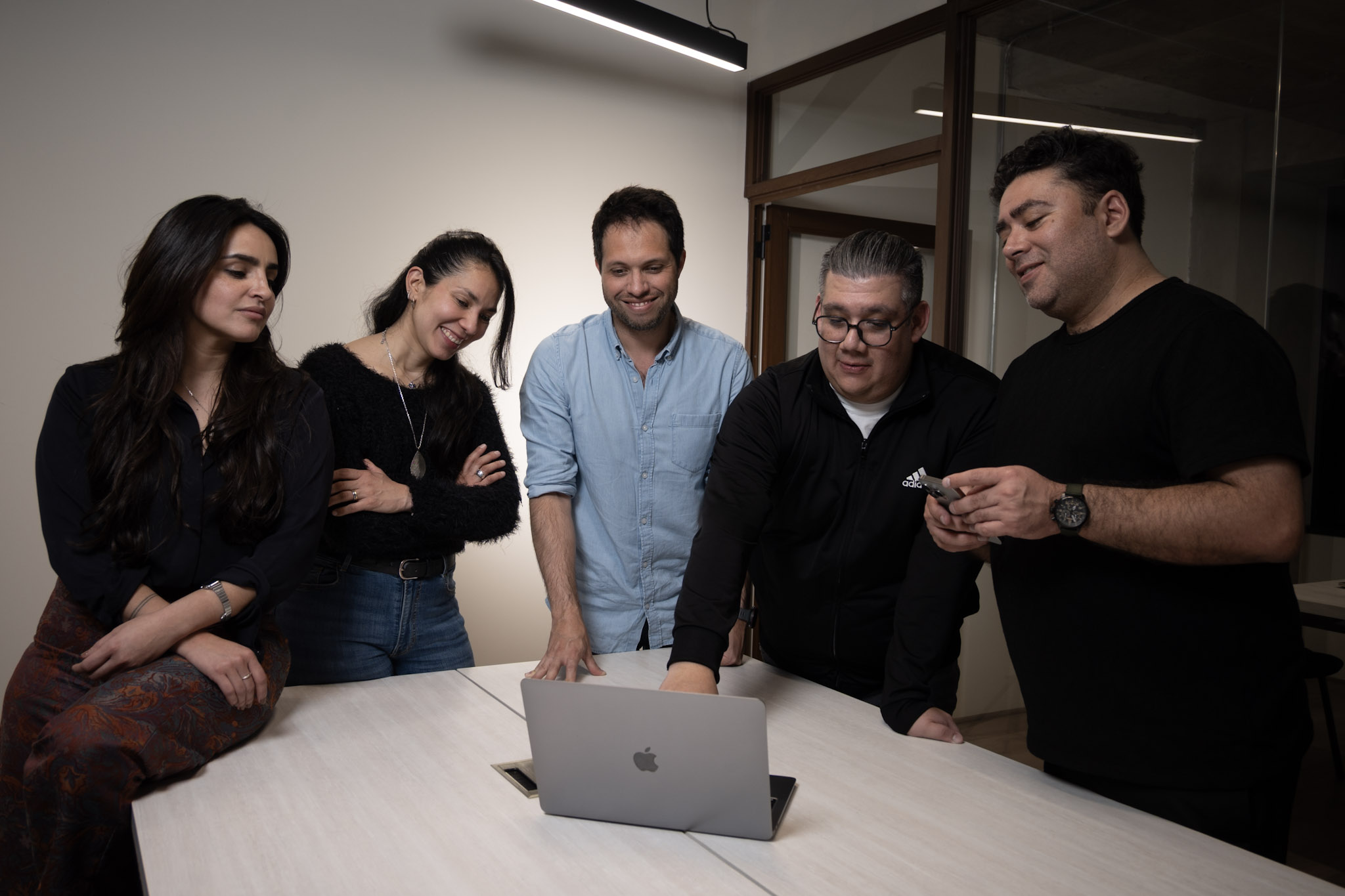 NLACE team working with a laptop