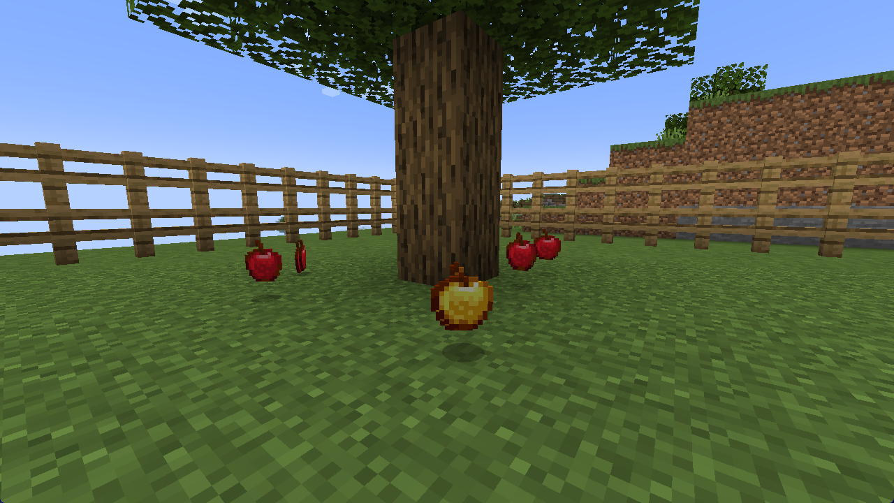 A golden apple lying among the apples under an oak