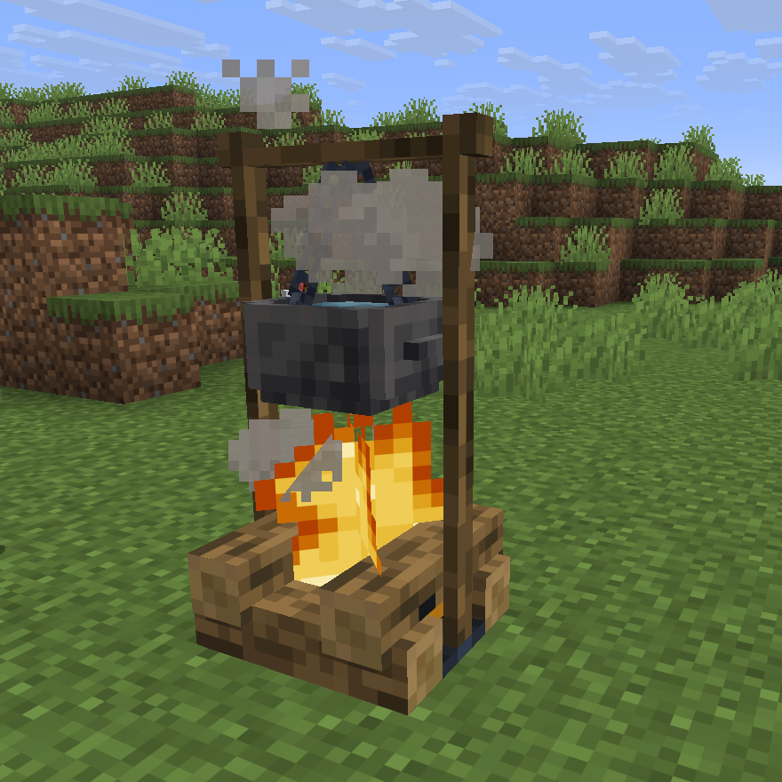 Iron Hanging Pot boiling water over a campfire
