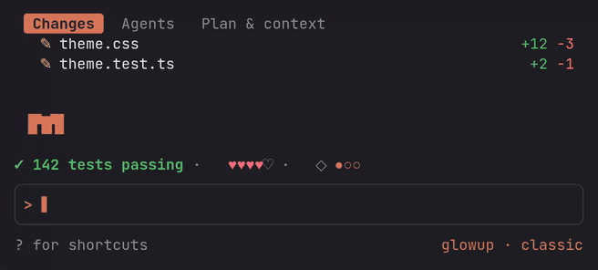 The compact layout in a narrow terminal: a tab strip with two changed files and Clawd's one-row glyph, then the band reading 142 tests passing