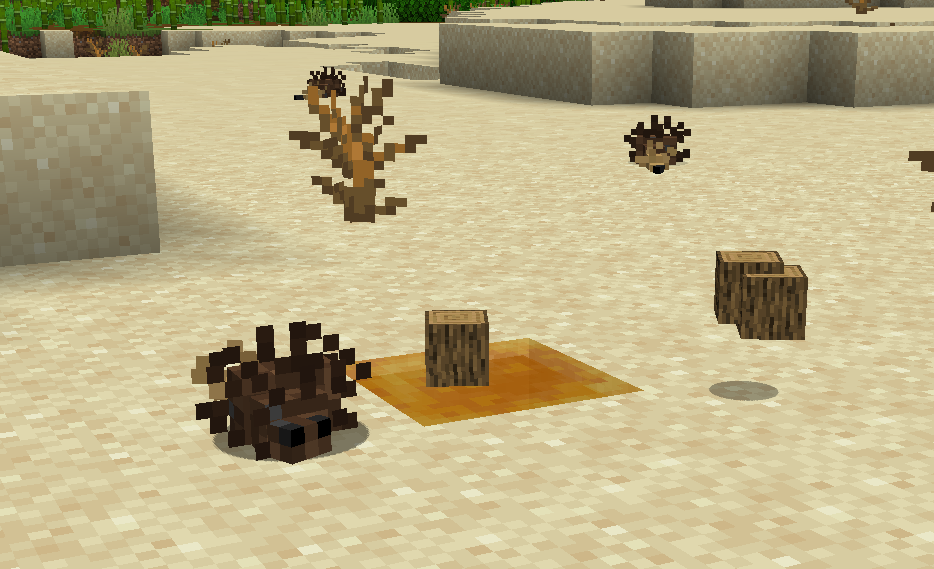 A picture of a mite, its resource, and a honey block in a desert.