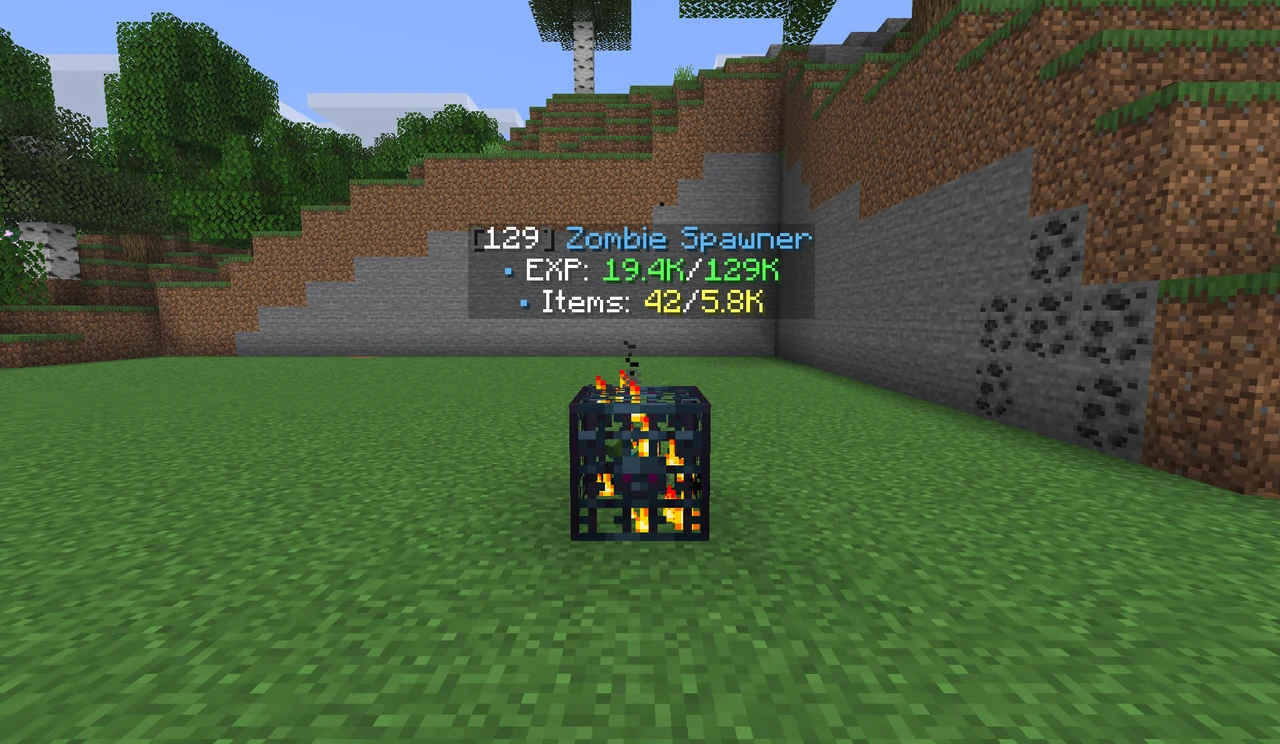 A stack of 129 zombie spawners with a hologram showing 19.4K of 129K experience and 42 of 5.8K items