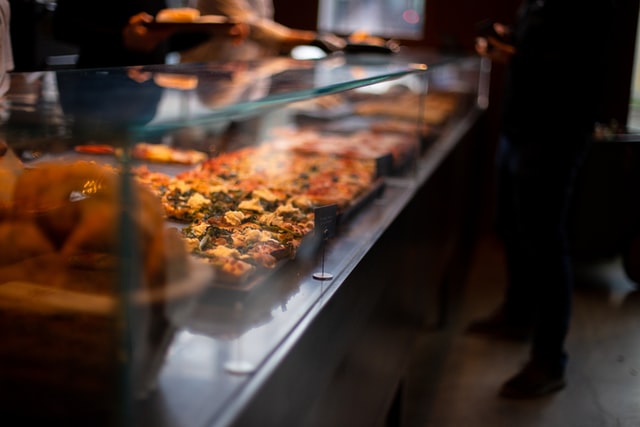 restaurant counter with pizza