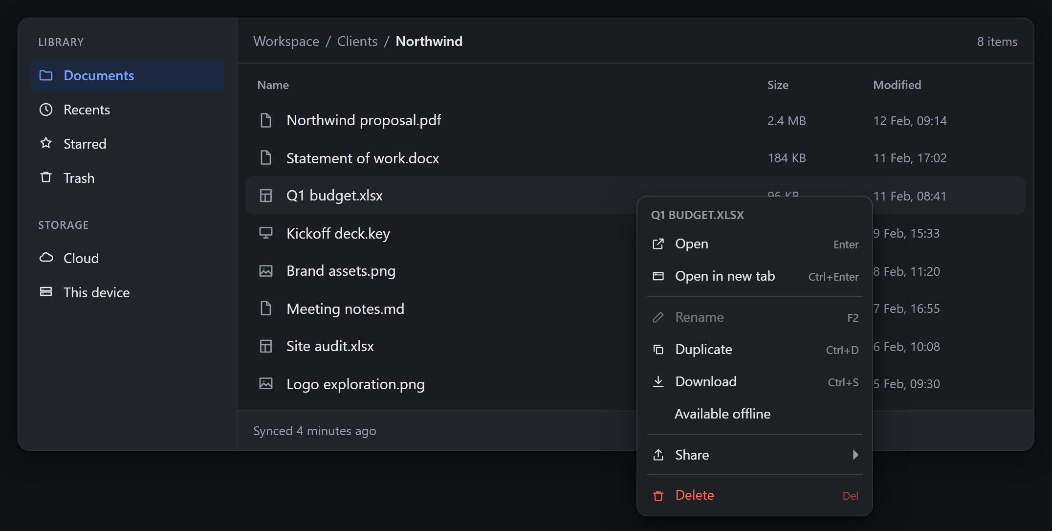The same file manager and the same menu in dark mode. The panel is near black
with light text, the hairline and separators are pale, and Delete is a lighter
red than in light mode.