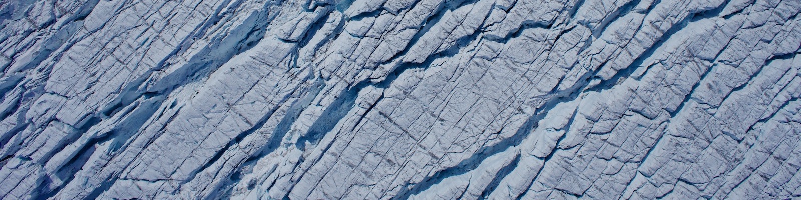 An aerial image of crevasses on the Greenland Ice Sheet