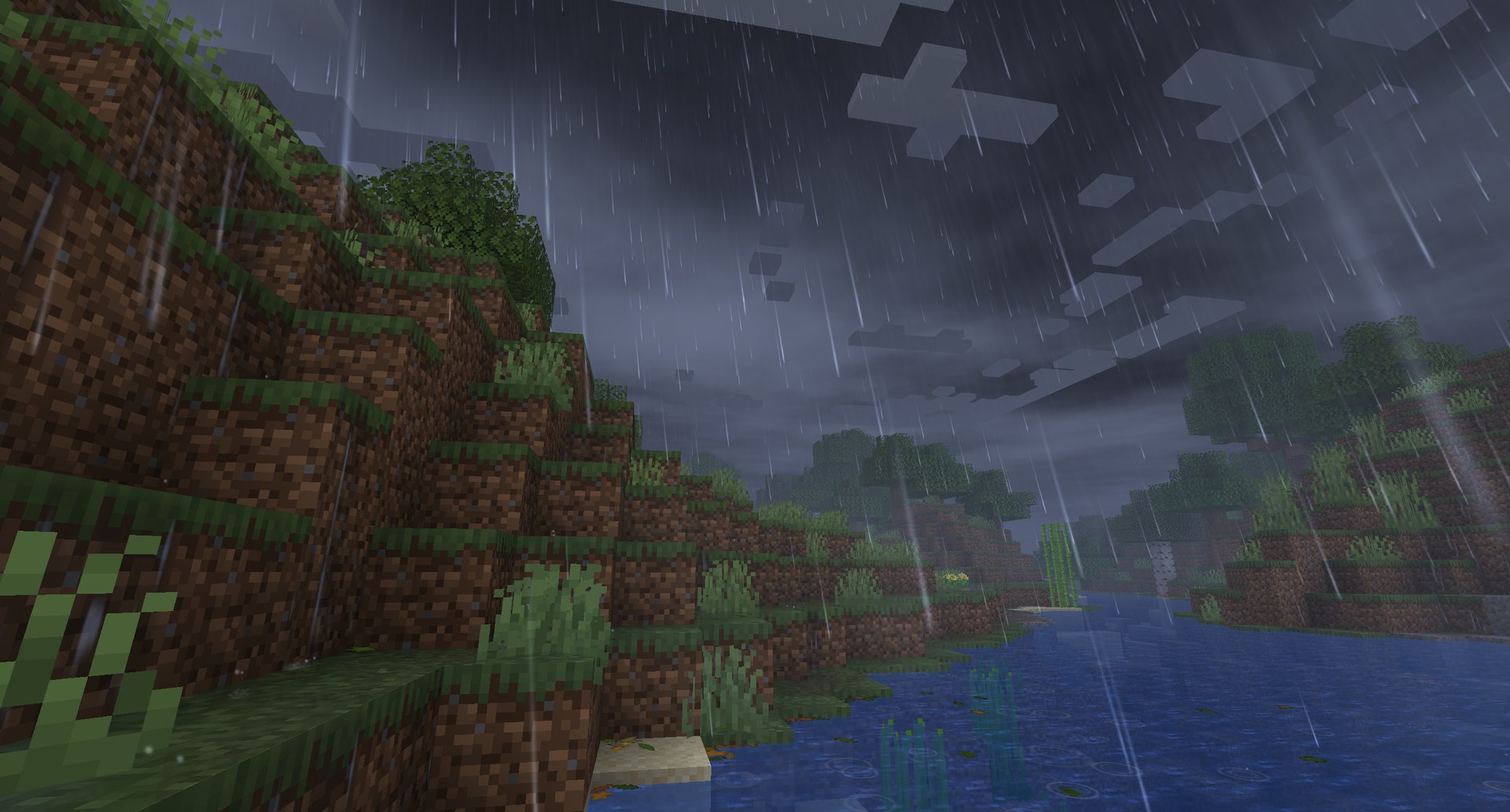 A downpour over the river under a heavy cloud deck