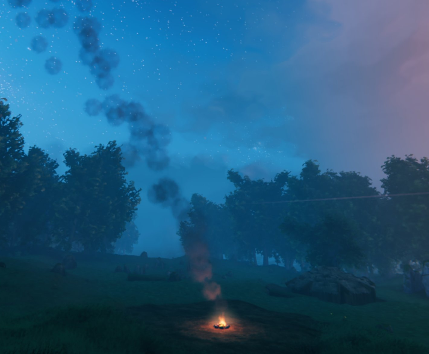 Smoke column from a campfire bending in the wind