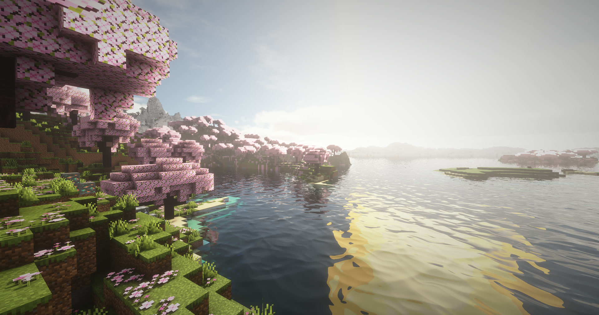 Earth at midday: a cherry grove by a lake