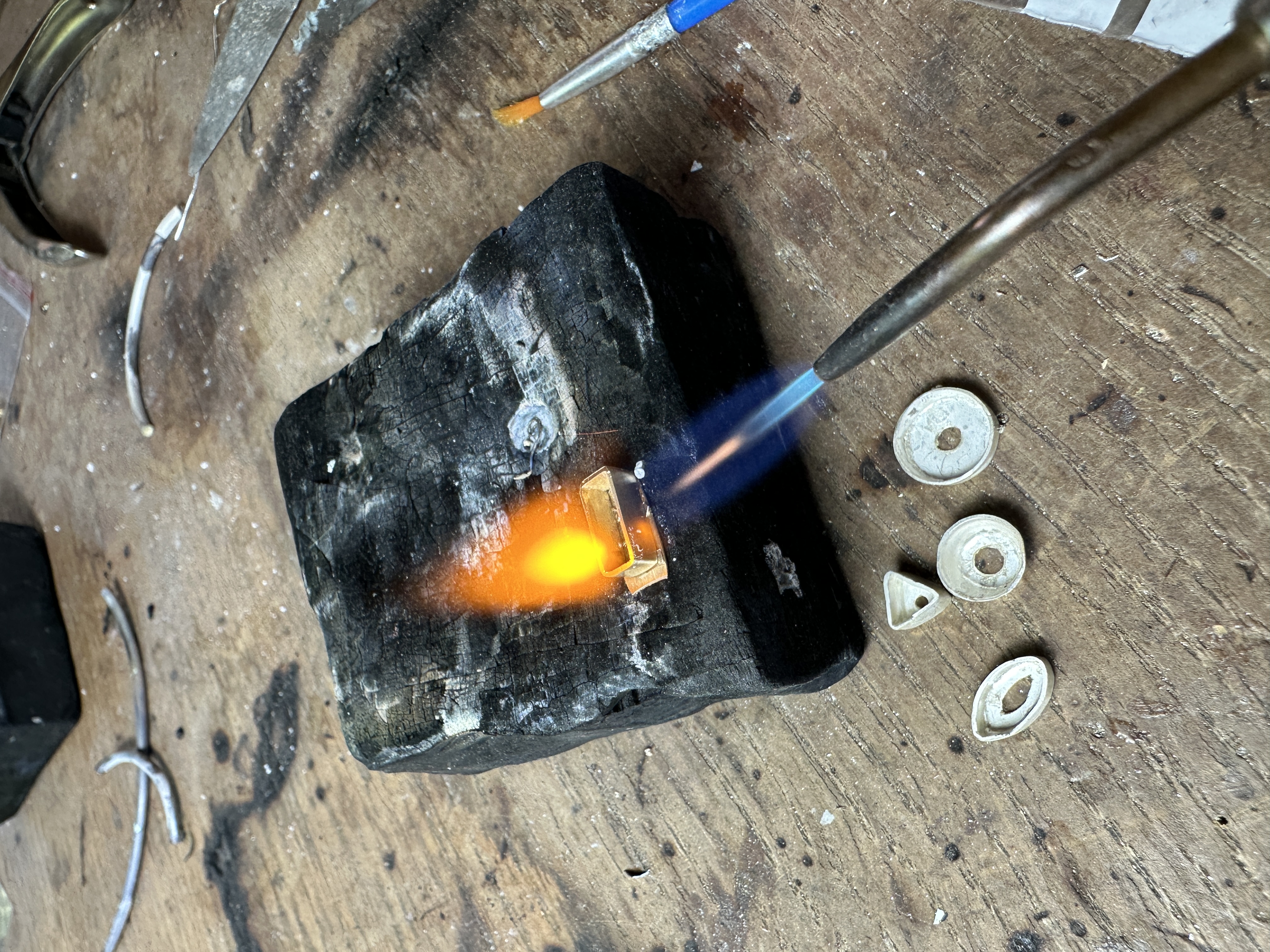 Jewellery being heated with a jeweller's torch