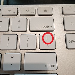 Photo of the pipe character on our keyboard