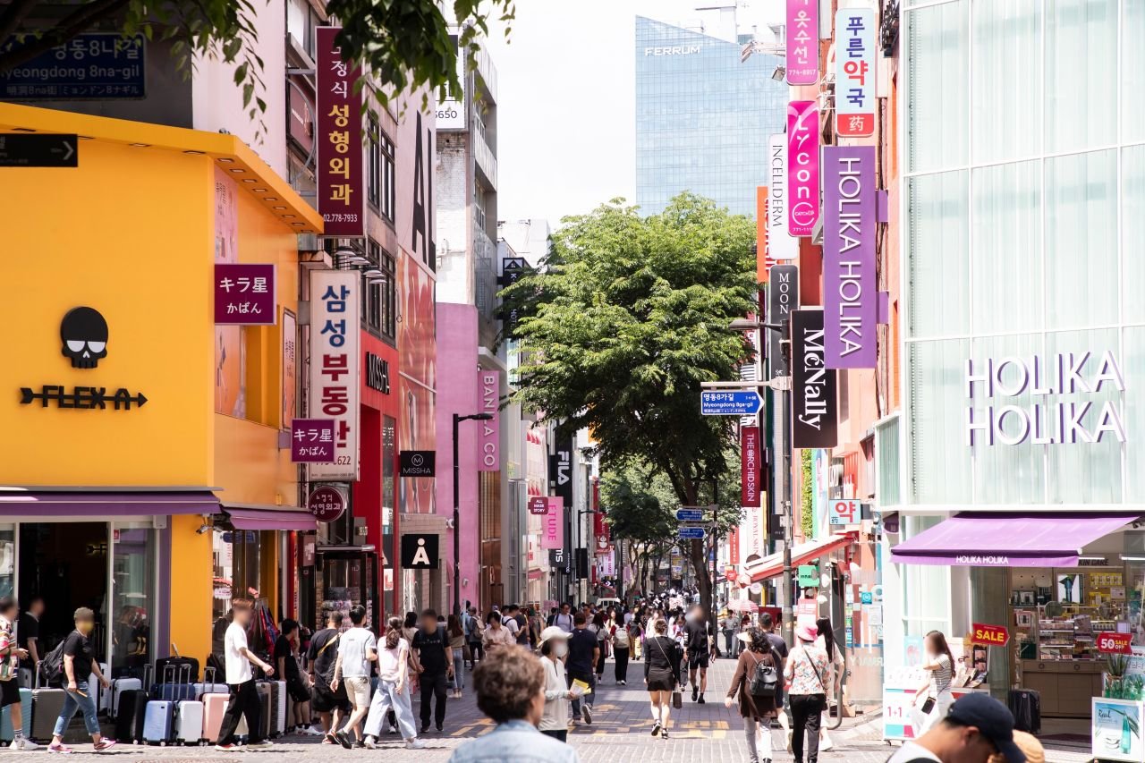 Myeongdong's cosmetics street in Seoul with Holika Holika, Missha and Etude storefronts, where COSRX sells at the Korea price (명동거리) — ⓒ한국관광공사 포토코리아-이범수 (Korea Tourism Organization, KOGL Type 1)