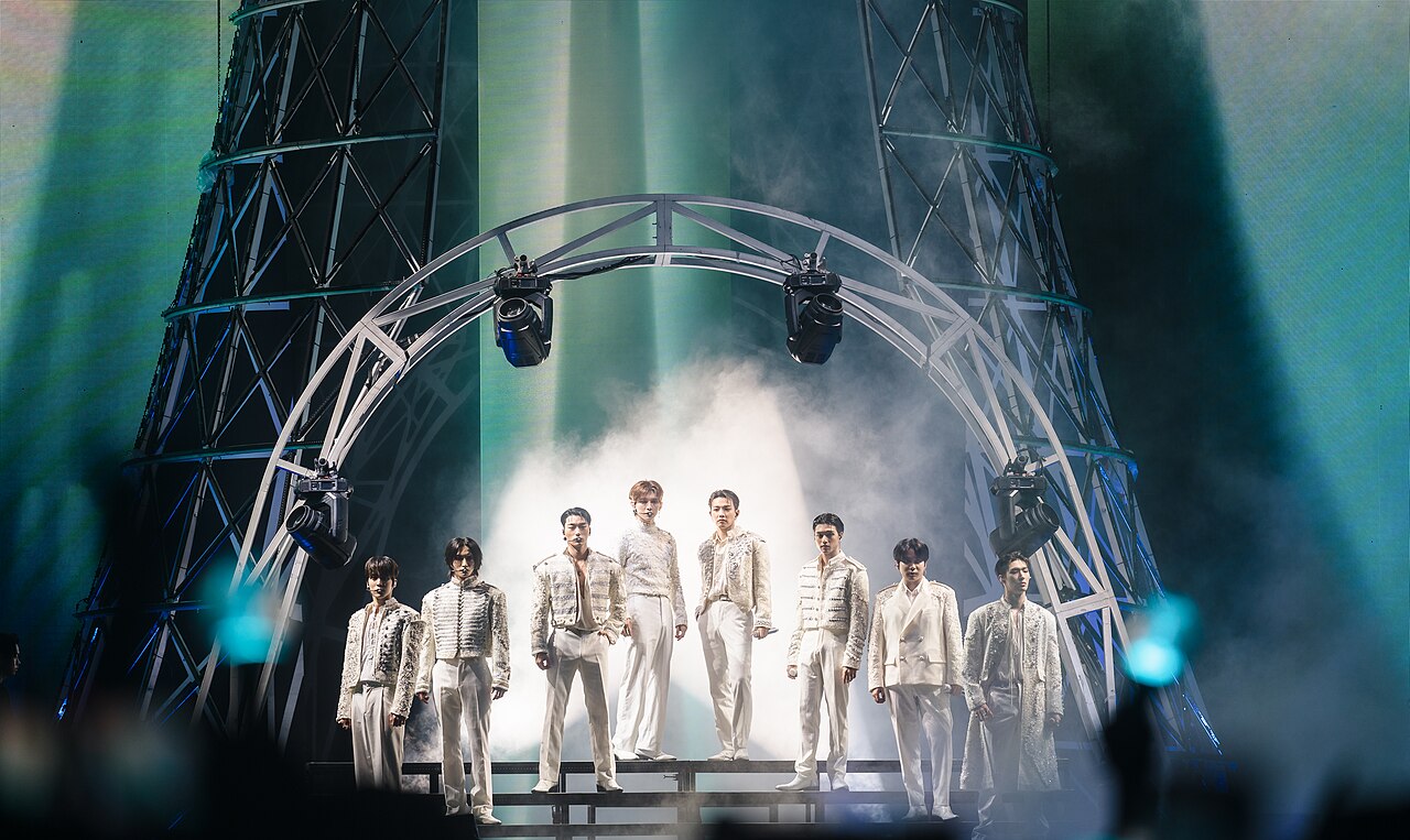 ATEEZ's eight members on stage at their Towards the Light: Will to Power concert in New York, August 2024. Photo by pinkllamanade, CC BY-SA 2.0, via Wikimedia Commons