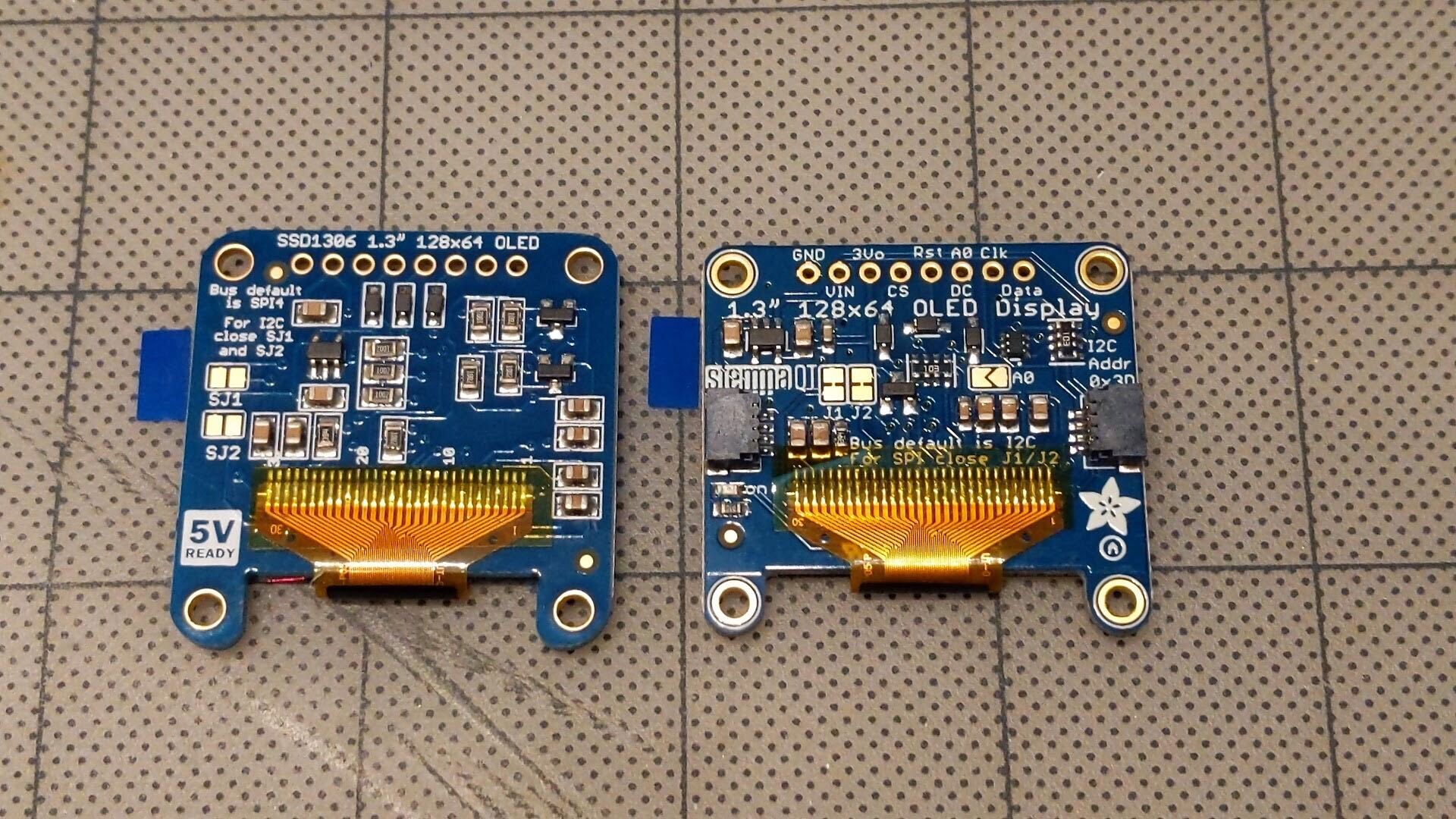 Old display with 5V Ready on left, new display with Ada Fruit on right