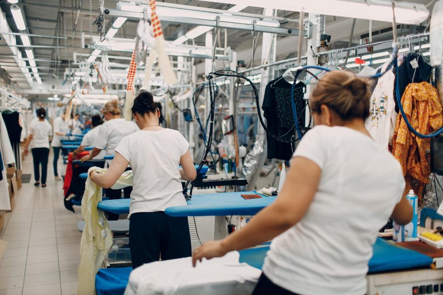 Production line running standardized cut and sew garment programs