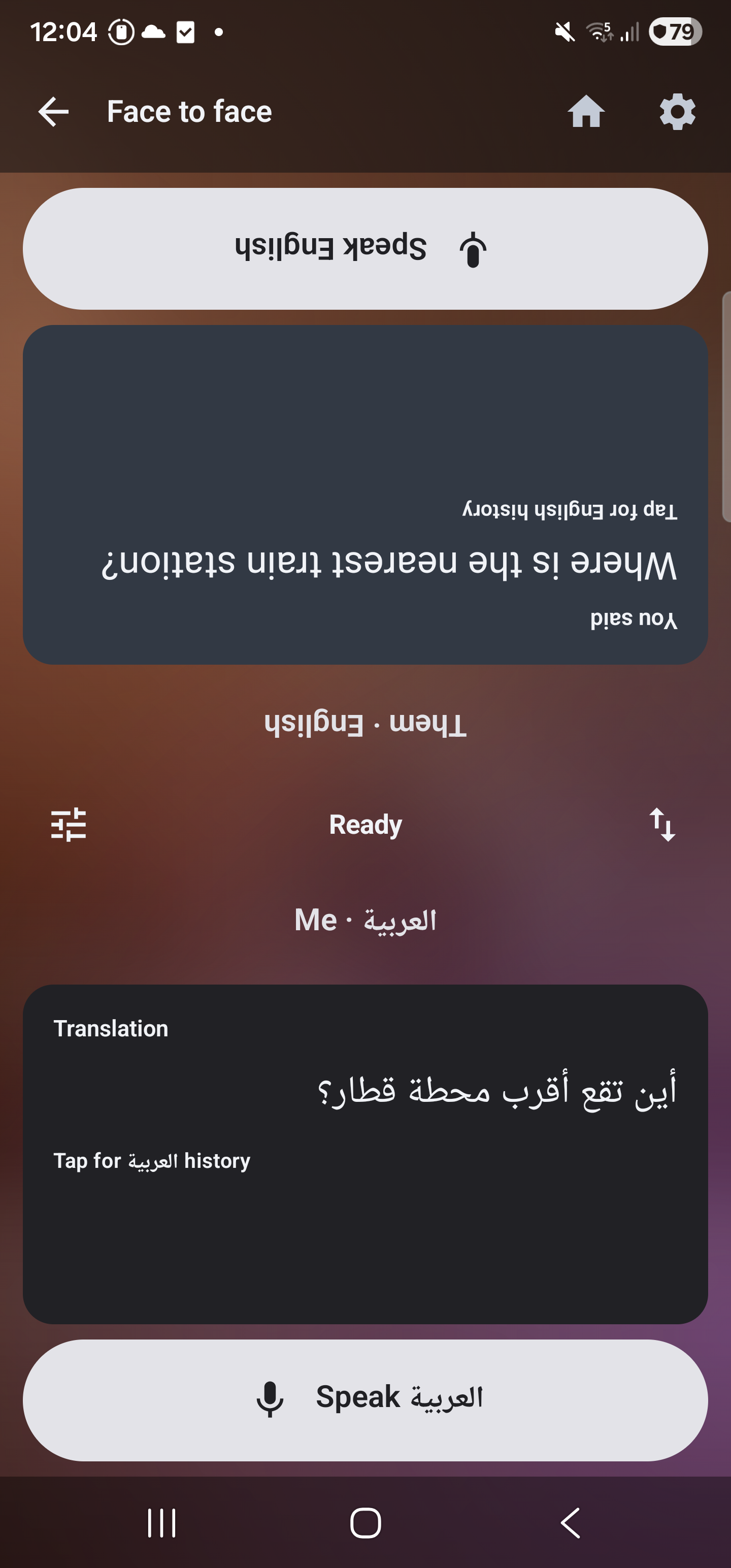 Two-person split layout with one half rotated and large Speak buttons
