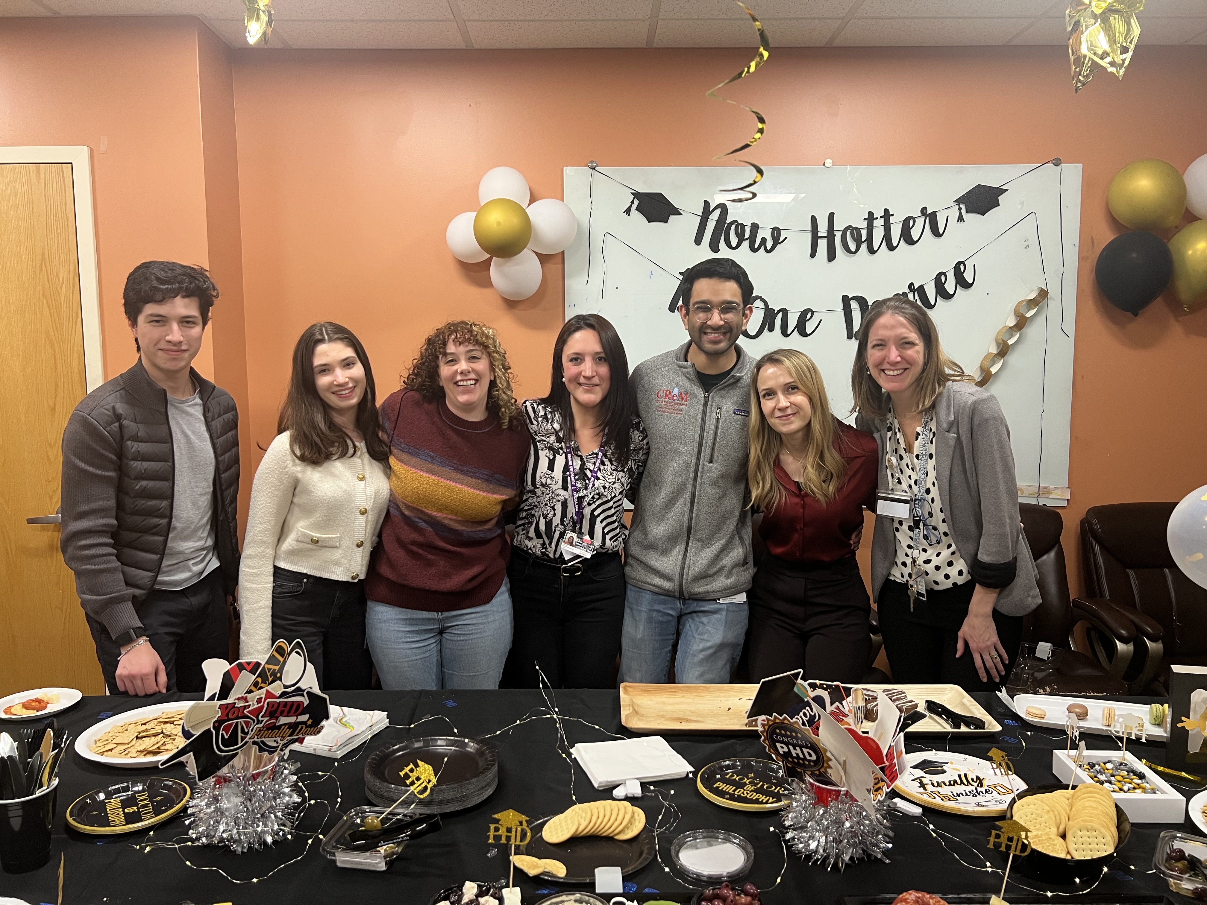 Carly celebrating after successfully defending her PhD thesis