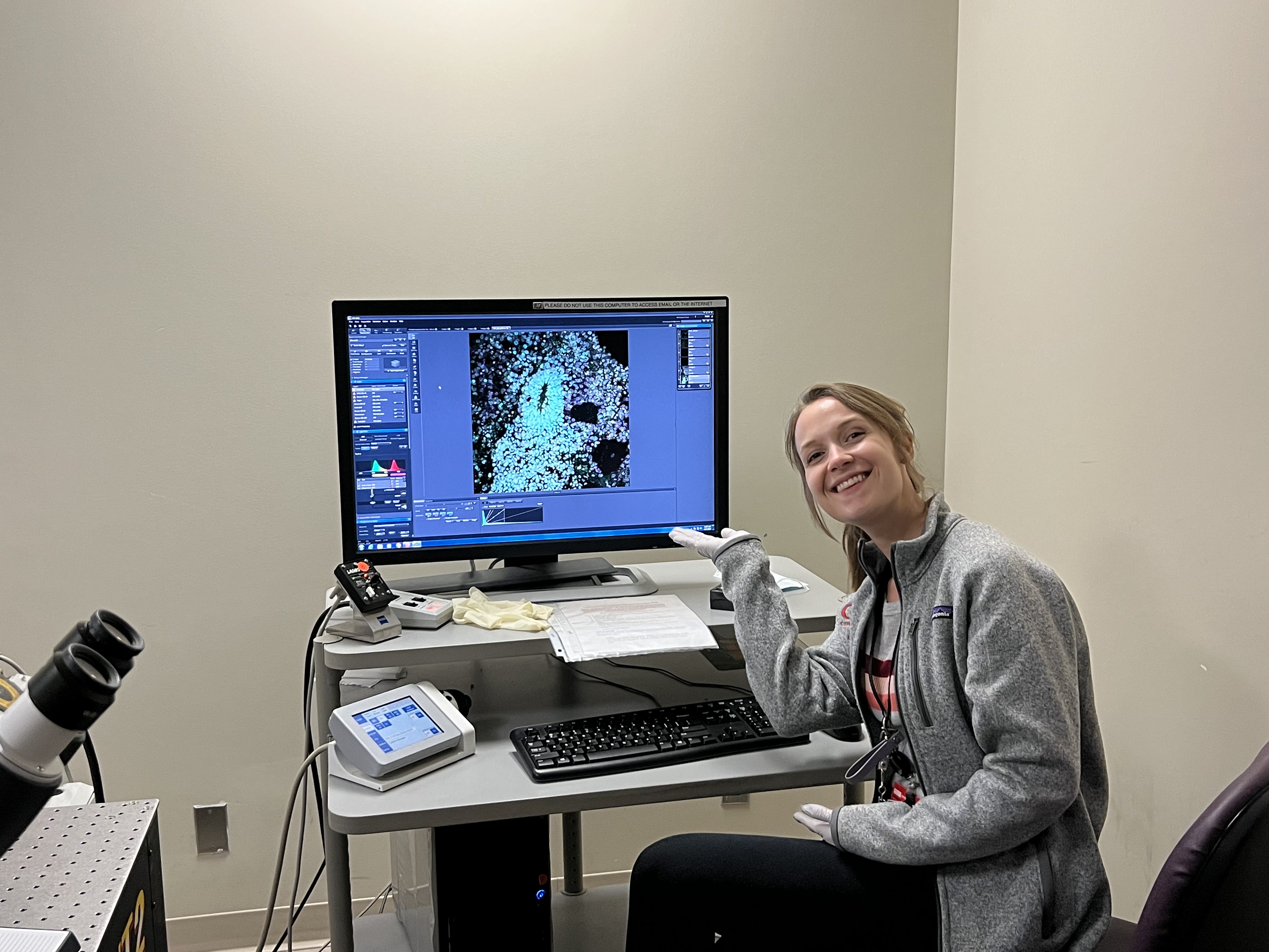 Carly's first confocal microscopy image displayed on a monitor