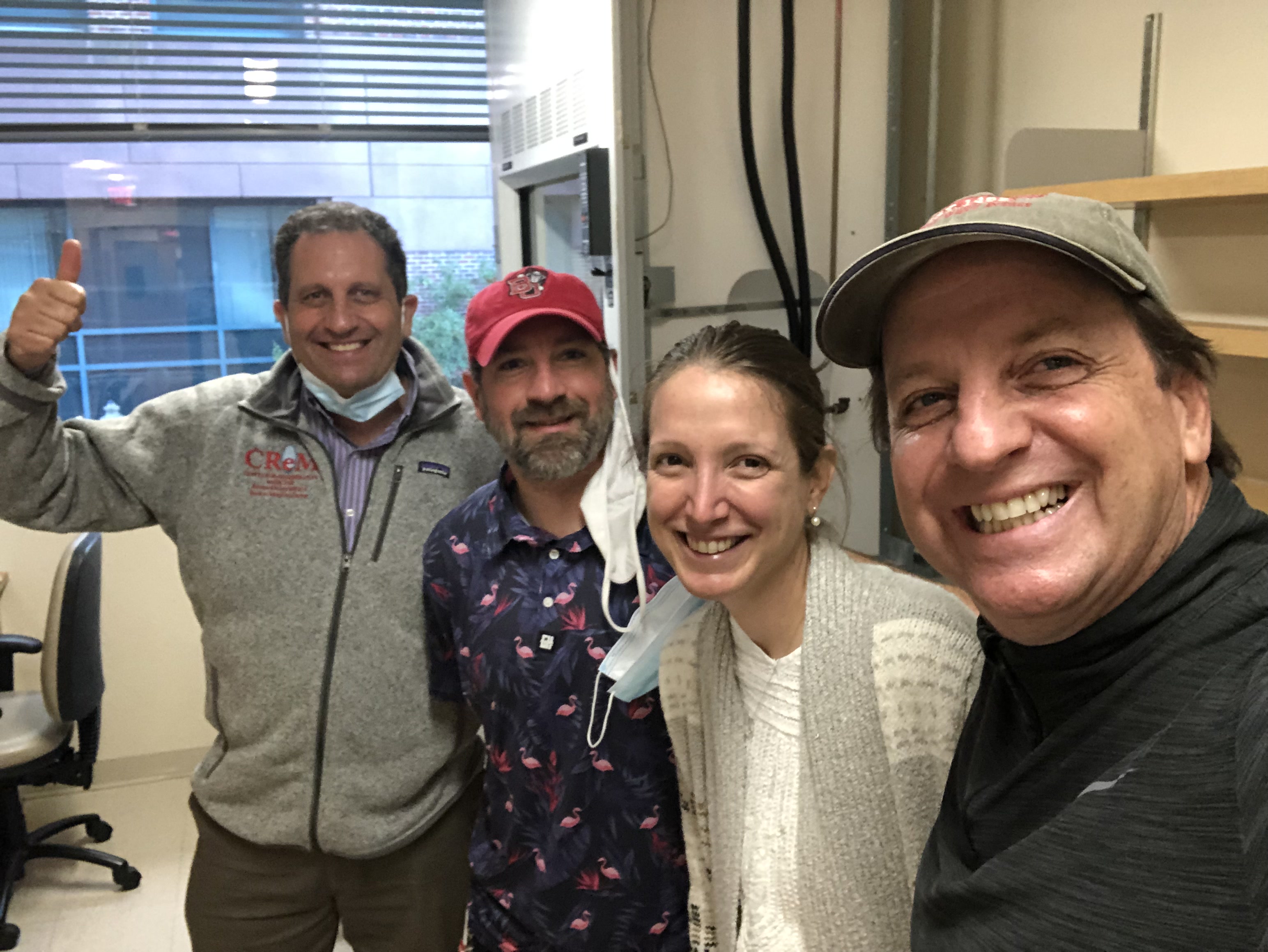 Darrel, Greg, and Gustavo smiling and welcoming the Serrano Lab