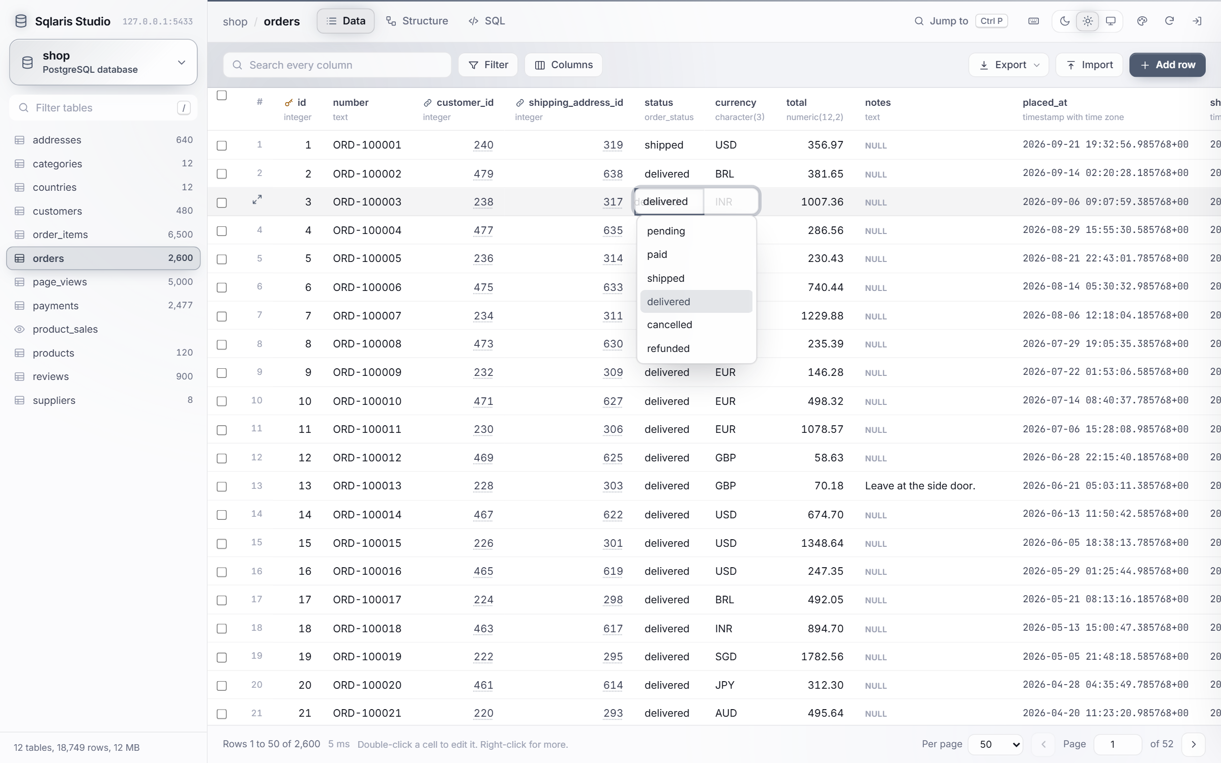 Double-clicking a status cell opens a dropdown of the enum values