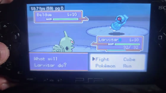 Pokémon Unbound's rival battle on a PSP-1000 with the FPS counter at 59.9, then the console's PSP-1001 label