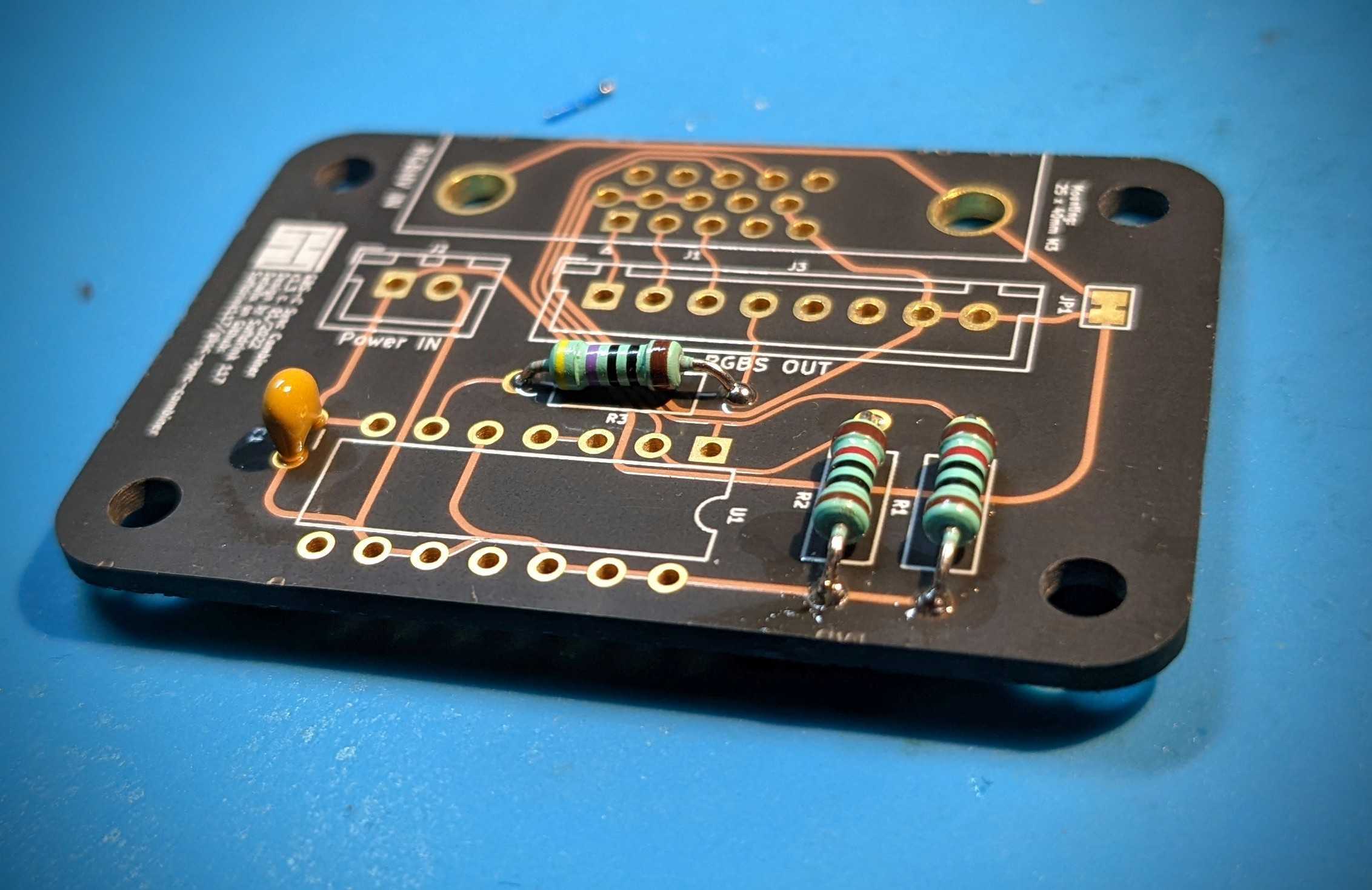 The first step of assembly: resistors and decoupling capacitor.