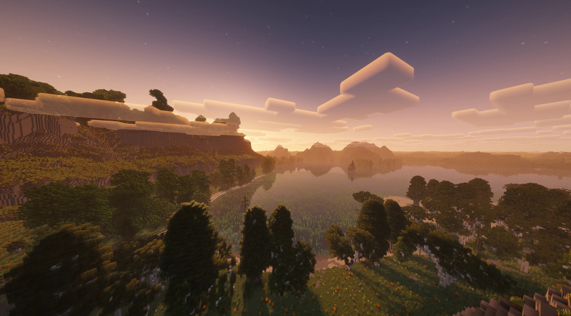 Sunset over a lake with far terrain from Distant Horizons
