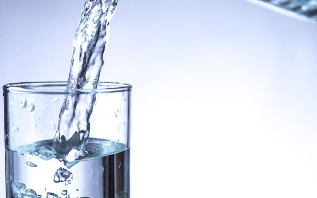 Glass of water with invisible contaminants