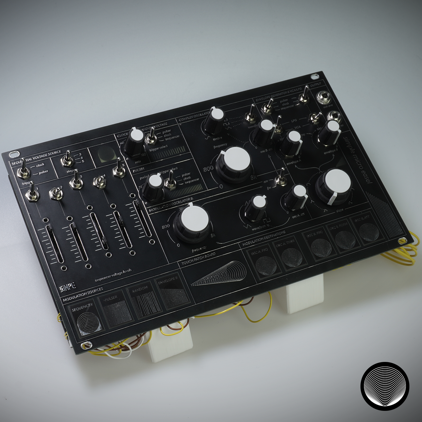 The Canvas synthesizer, a black panel with knobs, sliders and switches built on the Simple Designer