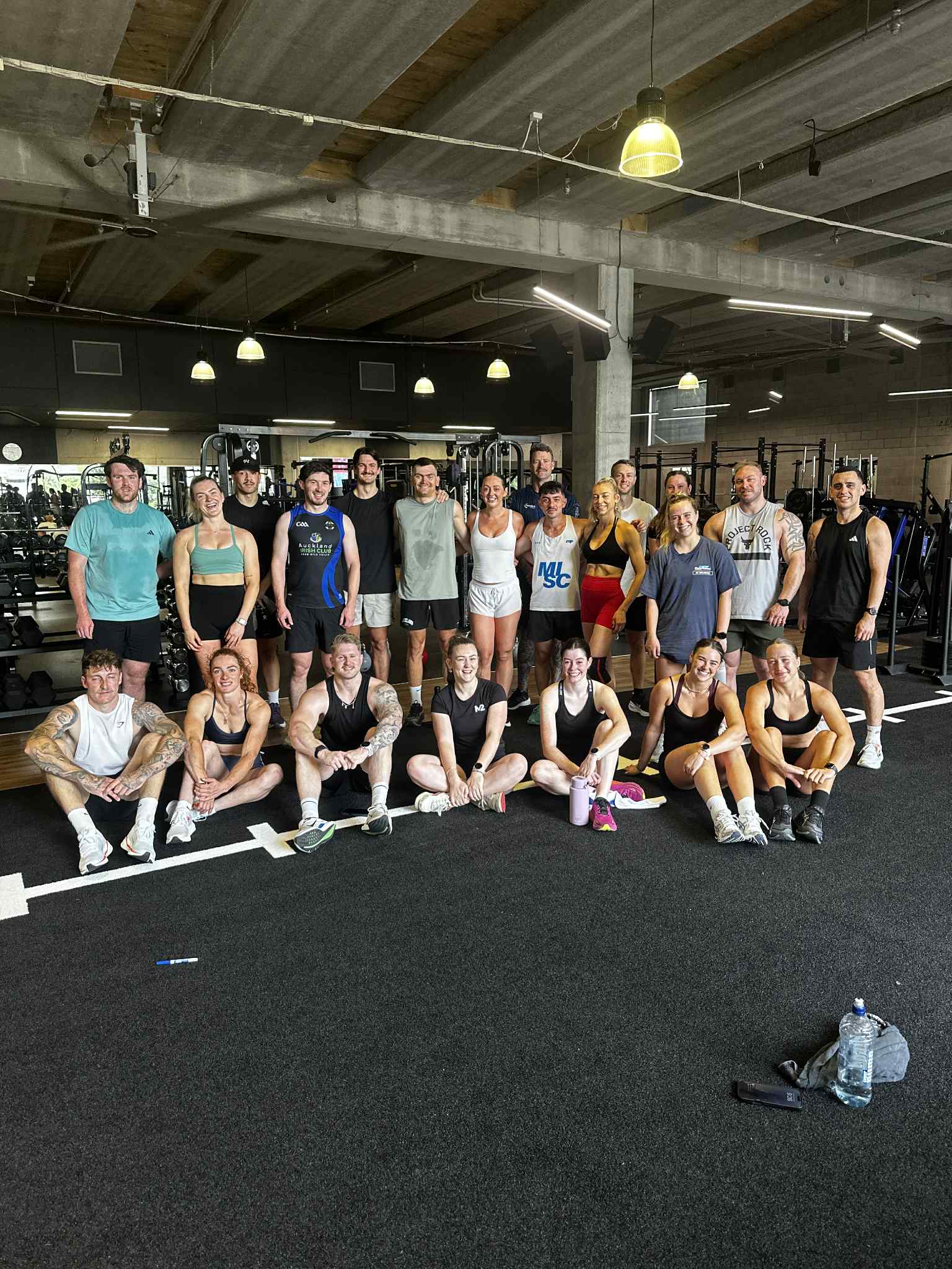 M2 members gathered together in the gym after training