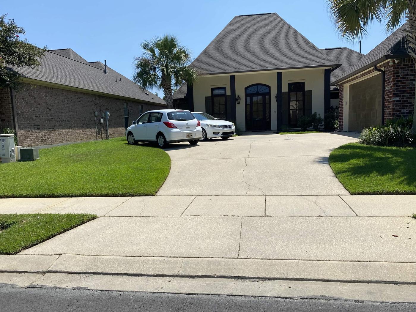 Helping Hands client home in Gonzales with freshly mowed lawn