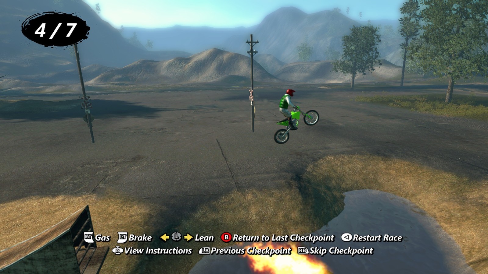 A wheelie over the dirt jumps