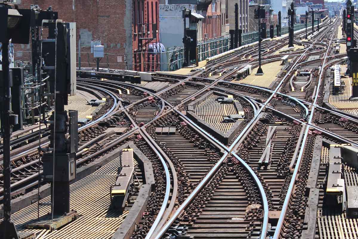 Rail supervisor discussing with field crew in safety gear