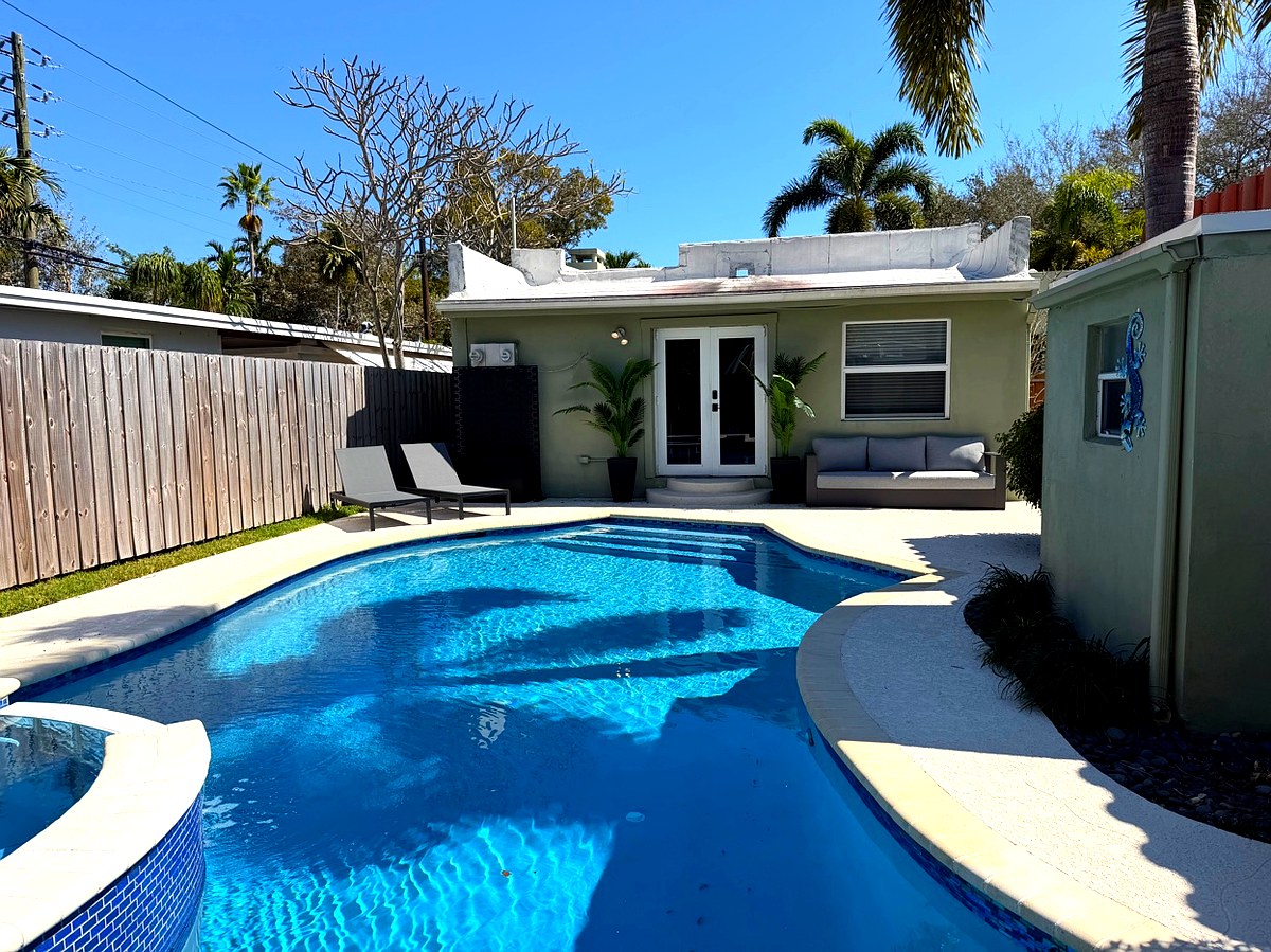 Pool and outdoor living area in daylight
