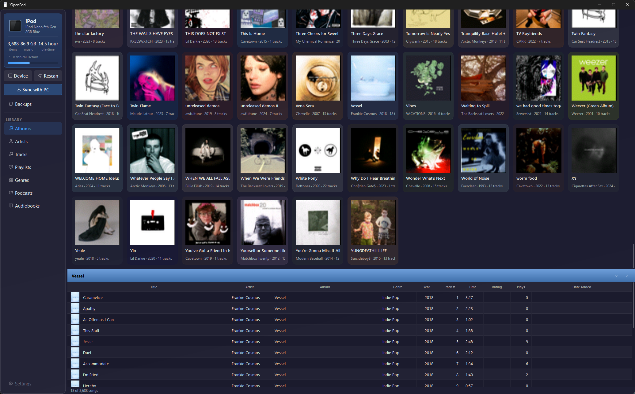 iOpenPod — open source iPod Classic sync tool showing album grid with artwork on Windows