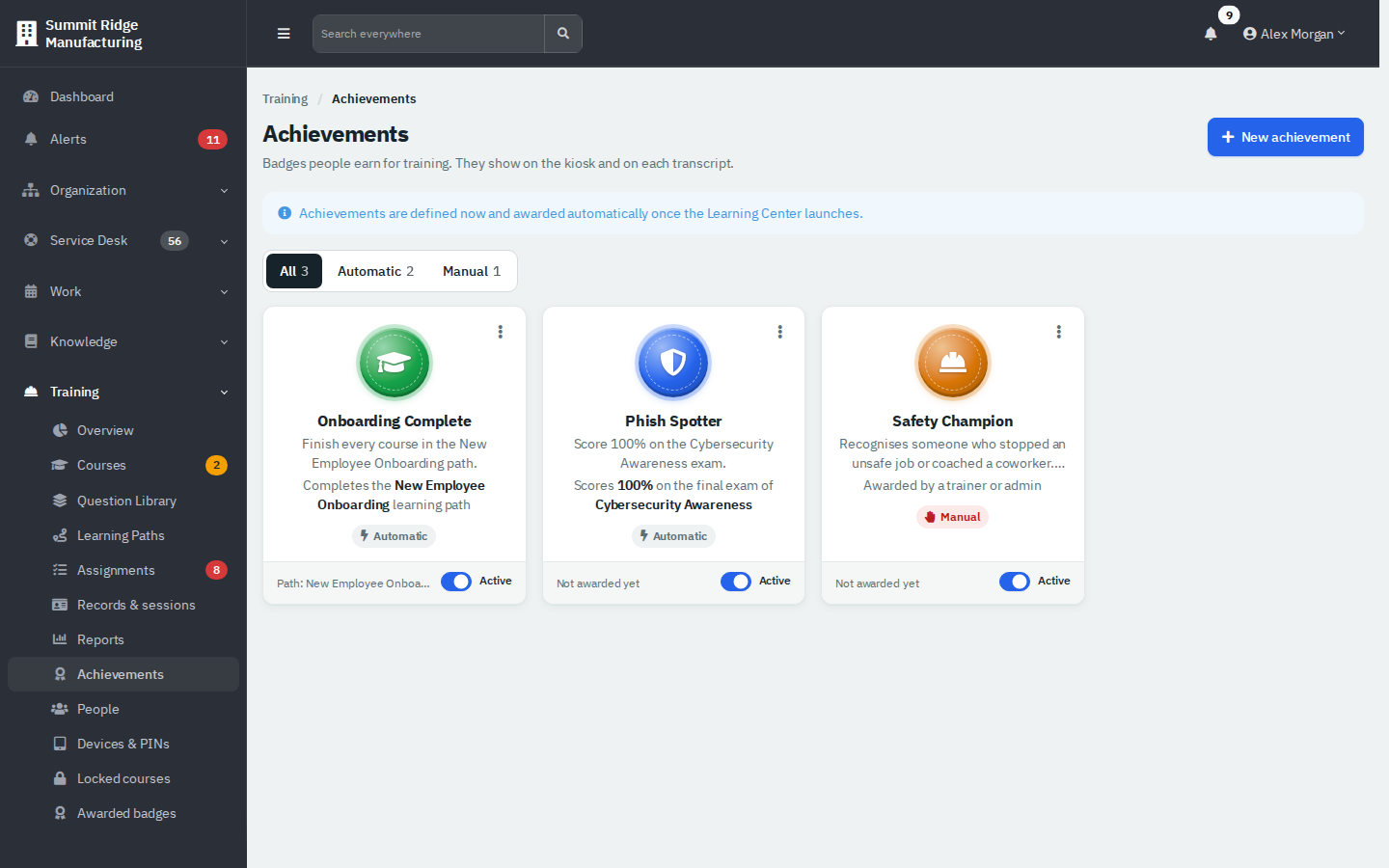 The Achievements page with three badge cards