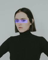 Thin horizantal transparent blue bar over woman's eyes