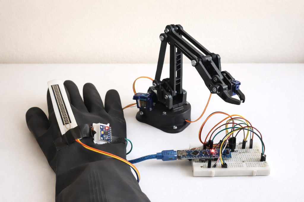 Gesture controlled robotic arm and wearable control glove