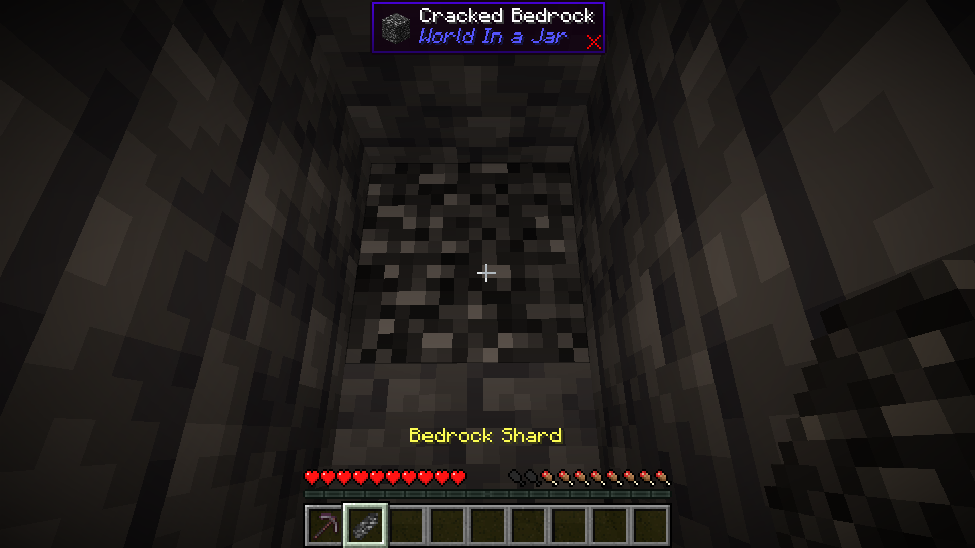 A player holding Bedrock Shards.