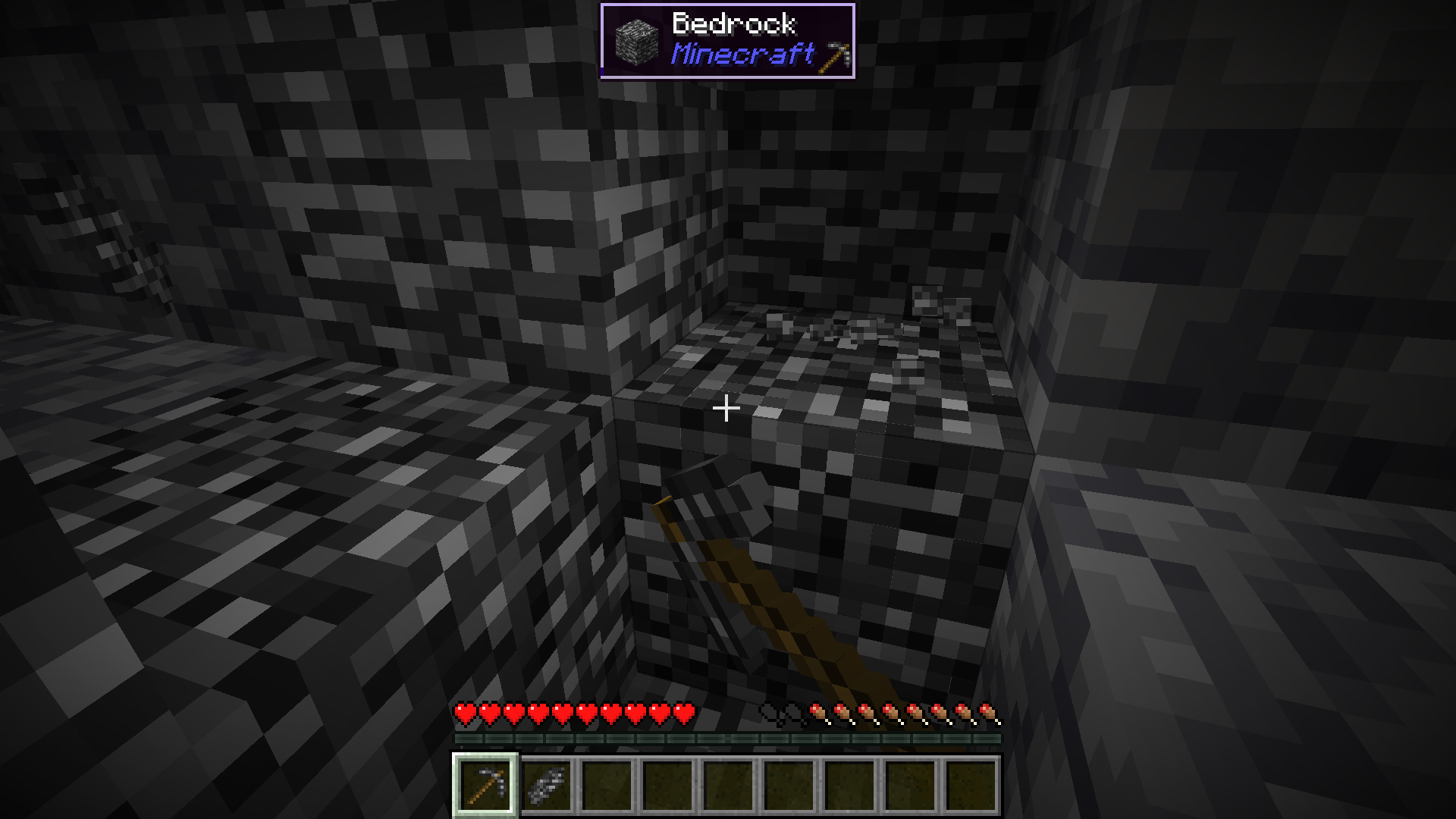 A Bedrock Pickaxe mining a Bedrock block.