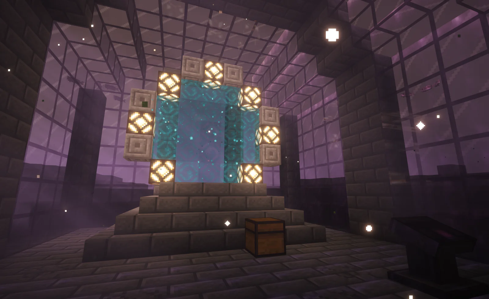 A stargate and its control panel in a dark stone chamber, with a supply chest at the foot of the gate