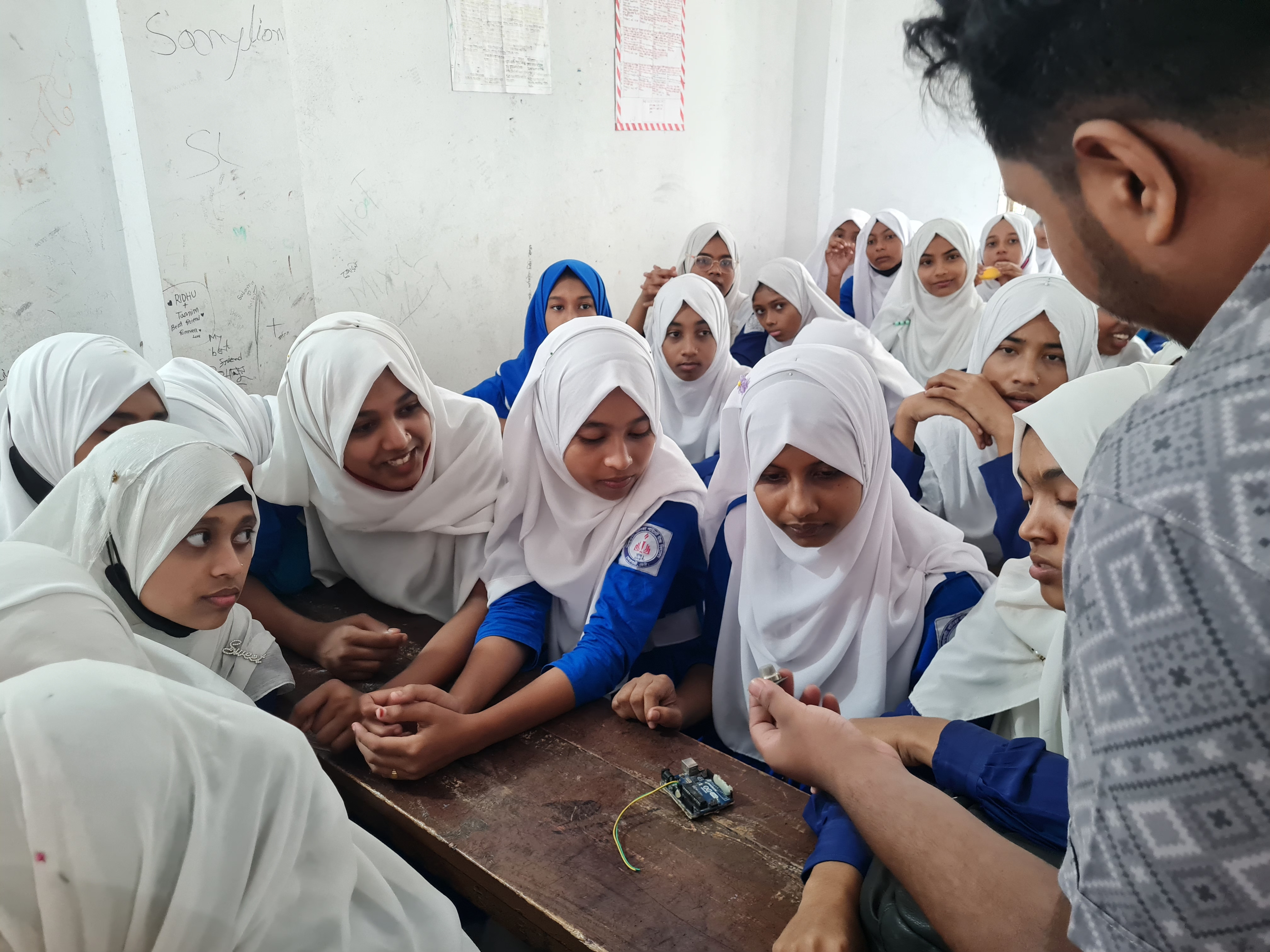 Students participating in a Project Uddipon robotics workshop