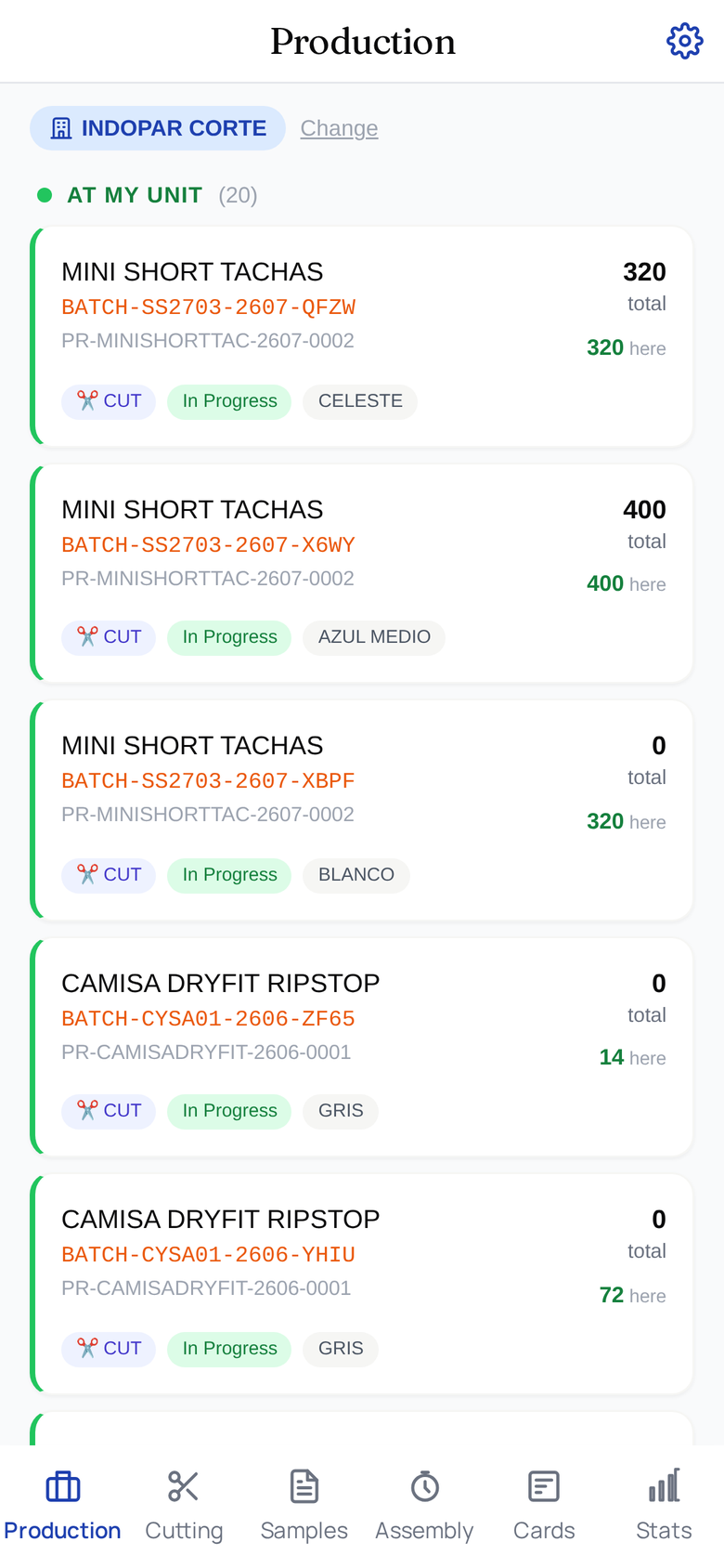 The Production App on a phone: the unit chip at the top (with a Change link), the "At My Unit" batch list showing each batch's model, quantities, operation and status chips, and the bottom tab bar with Production, Cutting, Samples, Assembly, Cards, and Stats.