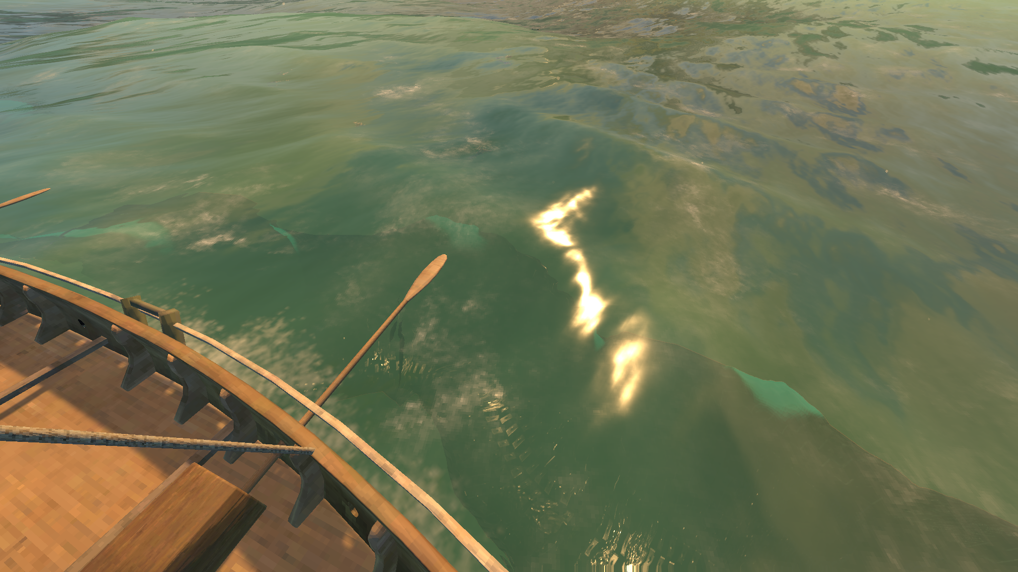 A long dark shape under bright water, beside the hull