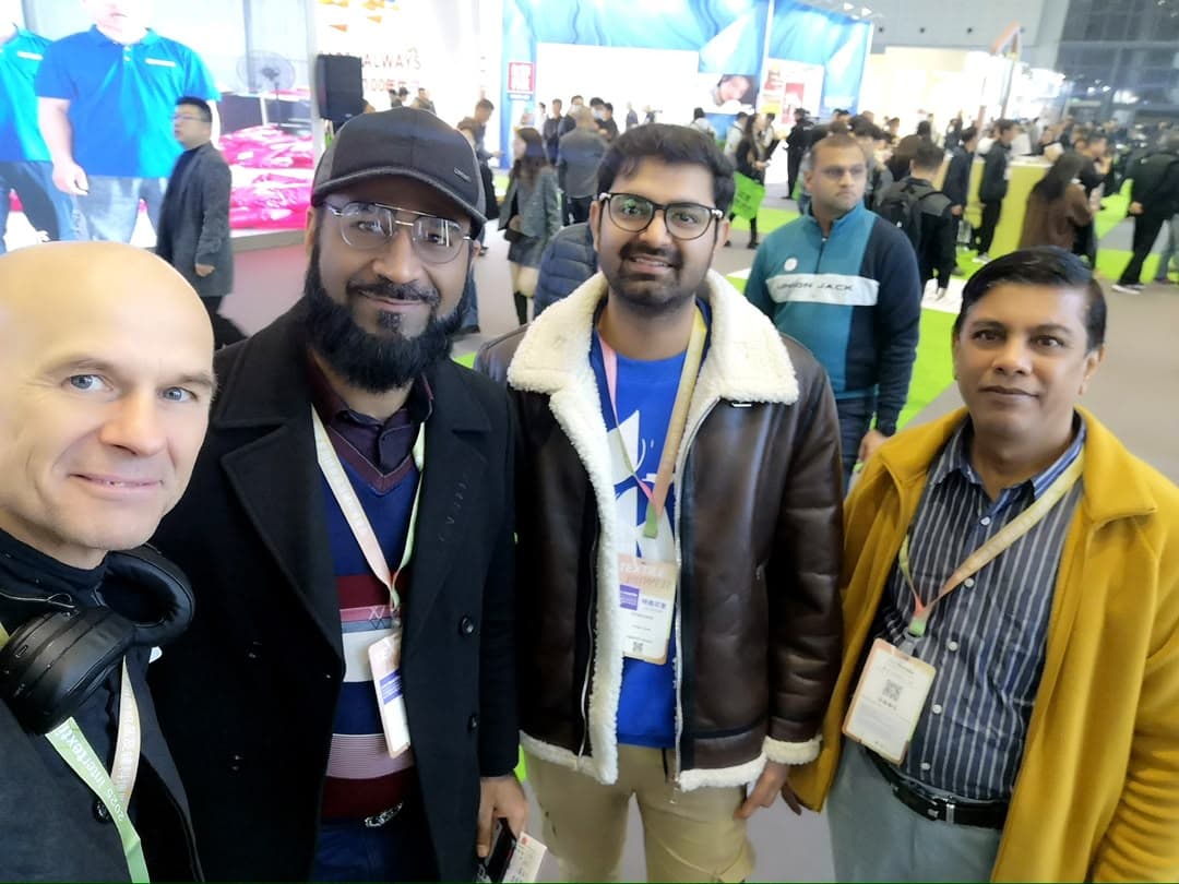 Shaikh China Sourcing team with international clients at a trade exhibition in China