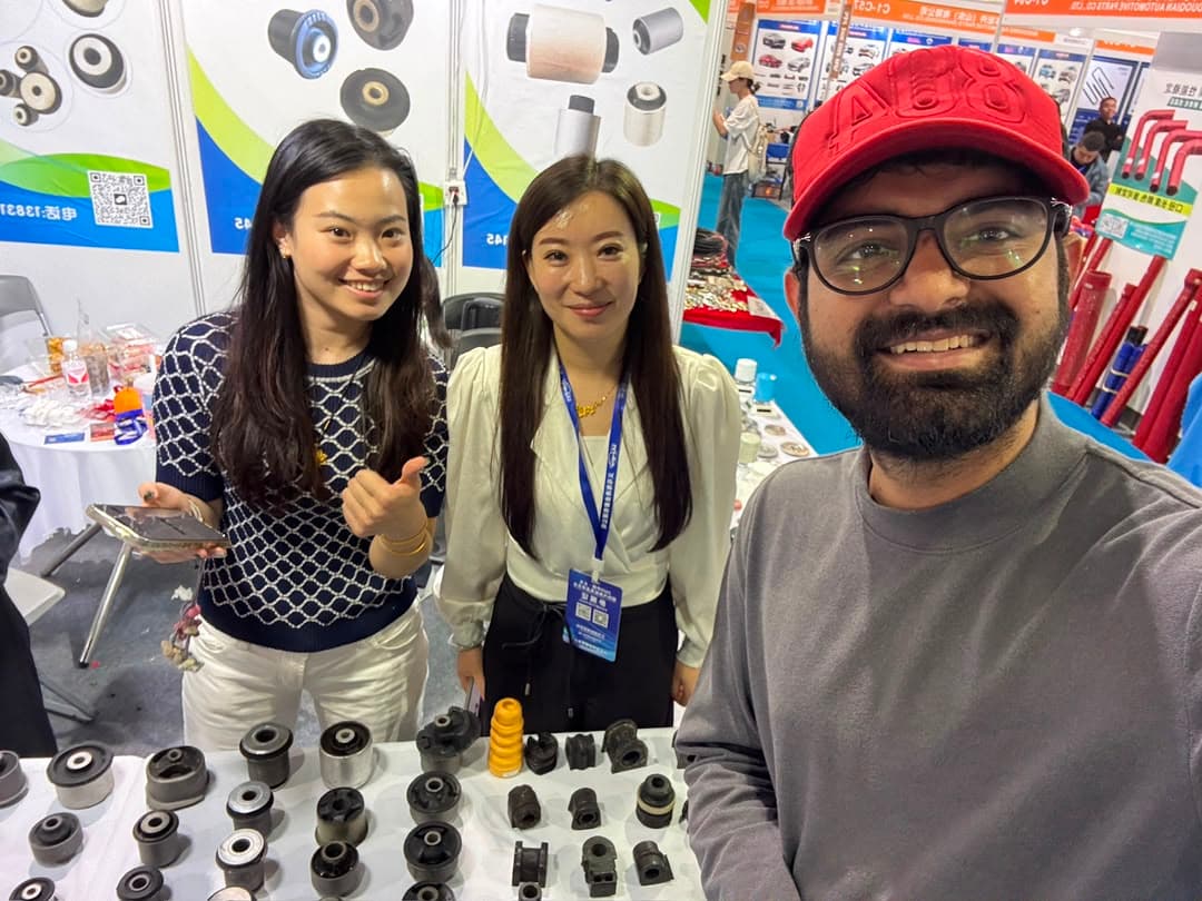 Shaikh China Sourcing representative meeting exhibitors at a China trade show