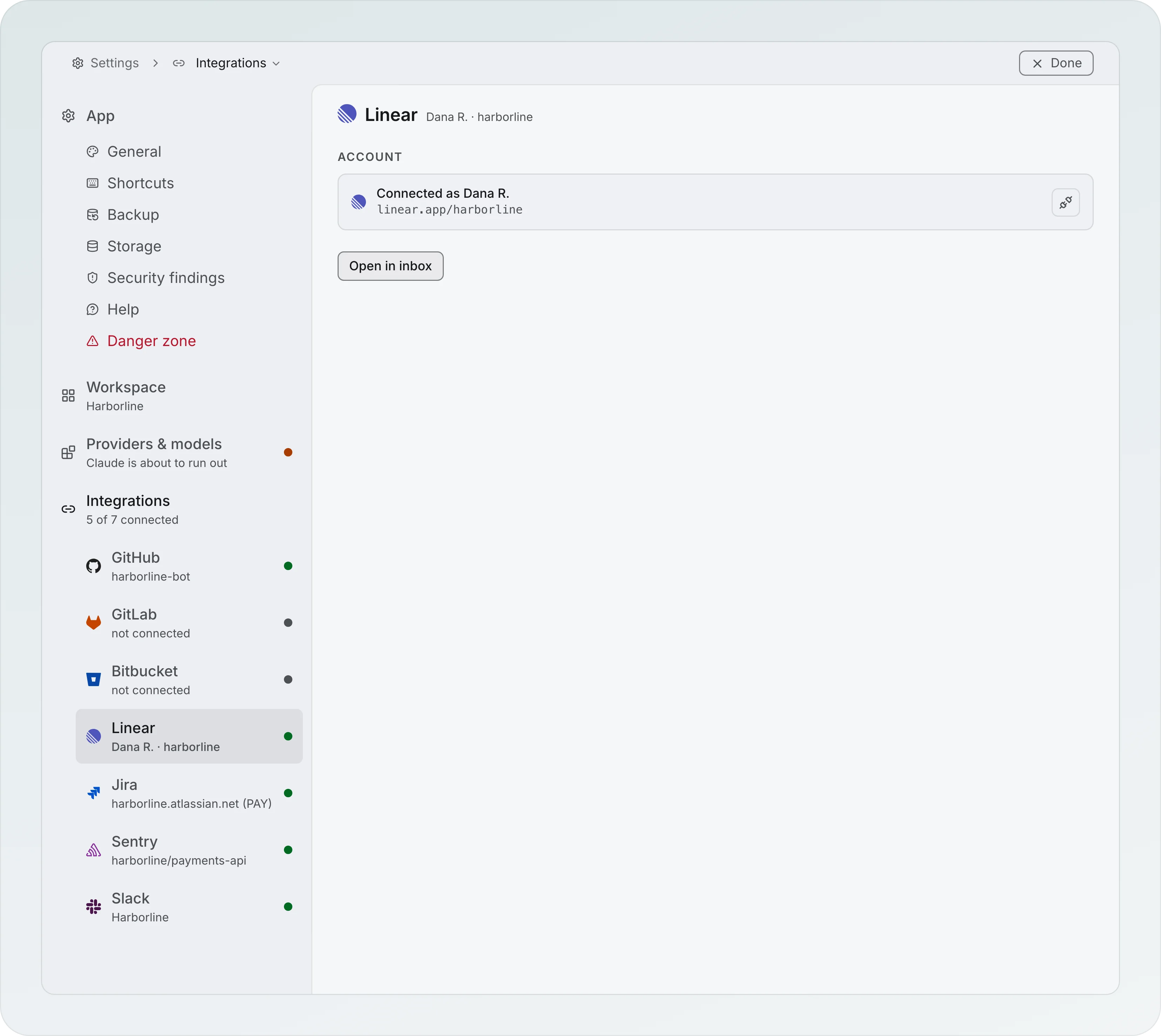 Settings under Integrations, 5 of 7 connected: GitHub, GitLab, Bitbucket, Linear, Jira, Sentry and Slack in the left list with a status dot each, and the Linear page open showing Connected as Dana R. on linear.app/harborline